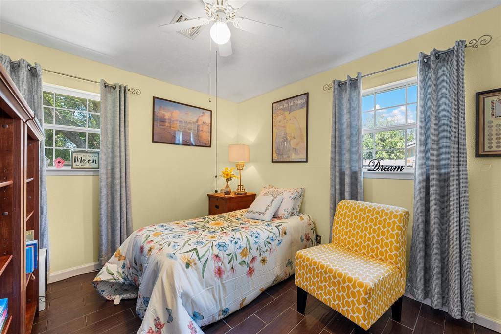 105 Gail Drive Waco, TX 76708 - Photo 16 of 36 a bedroom with a bed and wooden floor