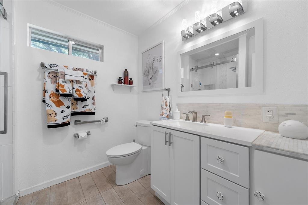 105 Gail Drive Waco, TX 76708 - Photo 17 of 36 a bathroom with a sink mirror and toilet