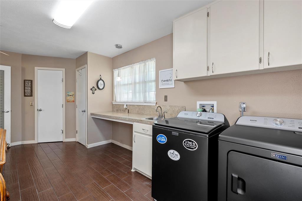 105 Gail Drive Waco, TX 76708 - Photo 19 of 36 a view of a kitchen with fridge and wooden floor