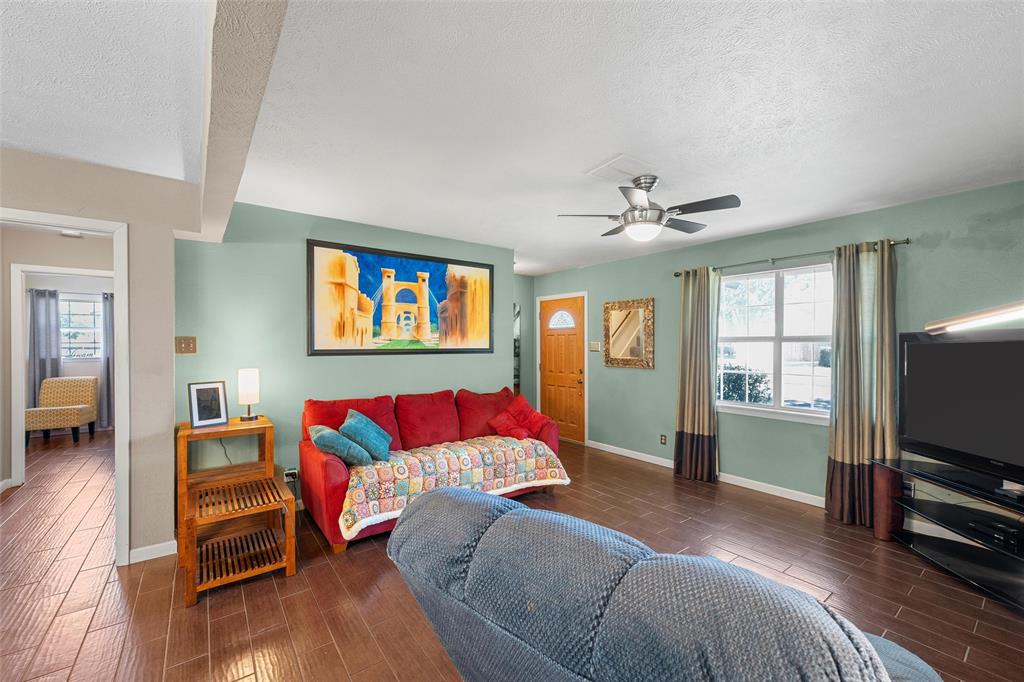 105 Gail Drive Waco, TX 76708 - Photo 20 of 36 a living room with furniture and a flat screen tv