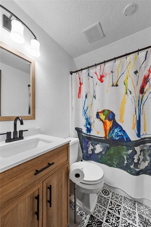 105 Gail Drive Waco, TX 76708 - Photo 26 of 36 a bathroom with a toilet a sink and a mirror