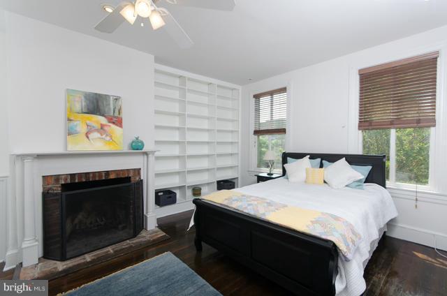 706 E Street Southeast Washington, DC 20003 - Photo 14 of 19 a bedroom with a bed and a fireplace