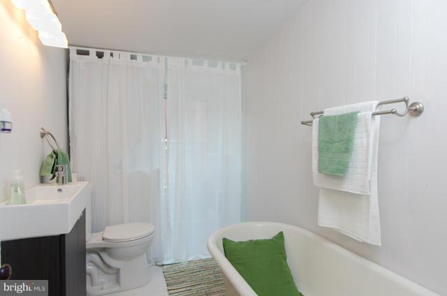 706 E Street Southeast Washington, DC 20003 - Photo 17 of 19 a bathroom with a sink a toilet and shower