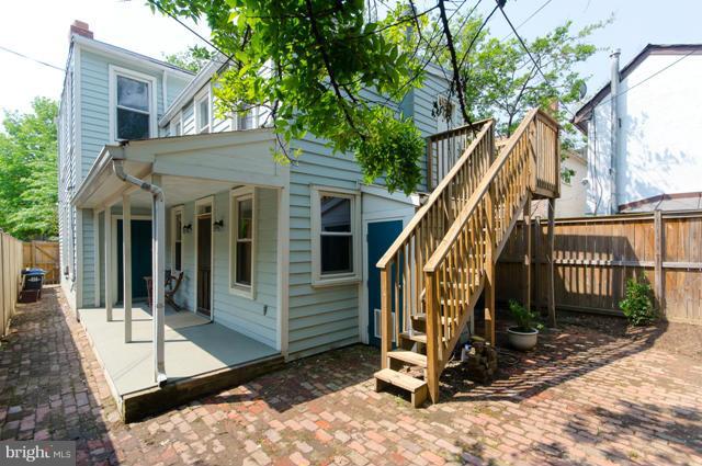 706 E Street Southeast Washington, DC 20003 - Photo 19 of 19 a view of a house with a small yard and wooden fence