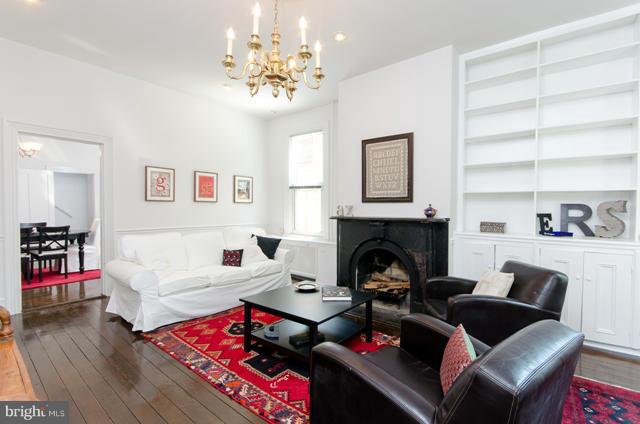 706 E Street Southeast Washington, DC 20003 - Photo 3 of 19 a living room with furniture and a fireplace