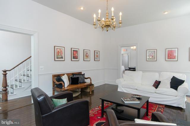 706 E Street Southeast Washington, DC 20003 - Photo 5 of 19 a living room with furniture and a chandelier