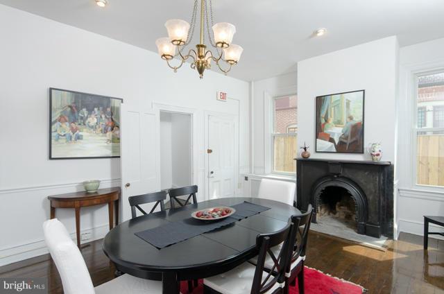 706 E Street Southeast Washington, DC 20003 - Photo 7 of 19 a view of a dining room with furniture and a chandelier