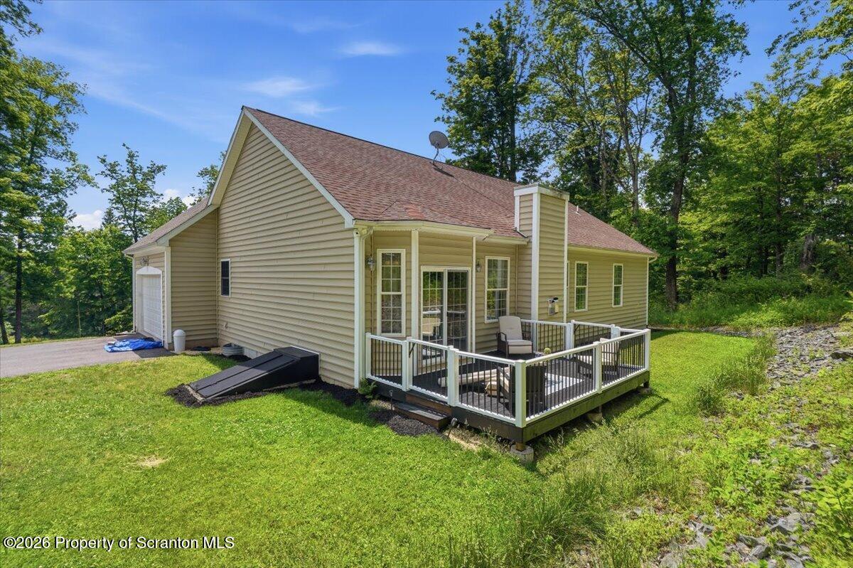 99 Hilltop Road Waverly, PA 18471 - Photo 36 of 41 a view of a house with a backyard