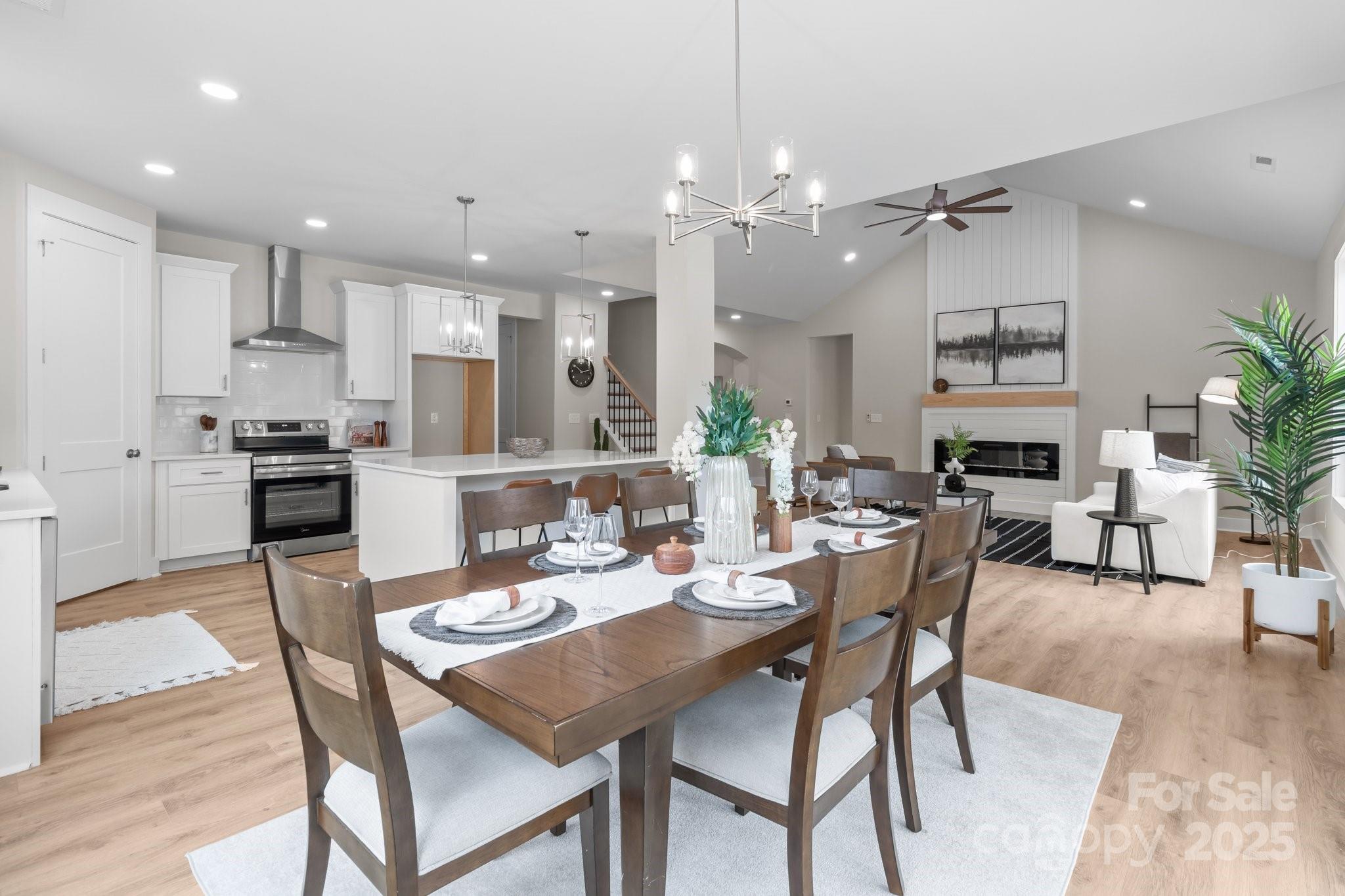 4949 Rimer Road, Unit 4 Concord, NC 28025 - Photo 11 of 46 a dining room with stainless steel appliances kitchen island granite countertop a dining table chairs and view kitchen