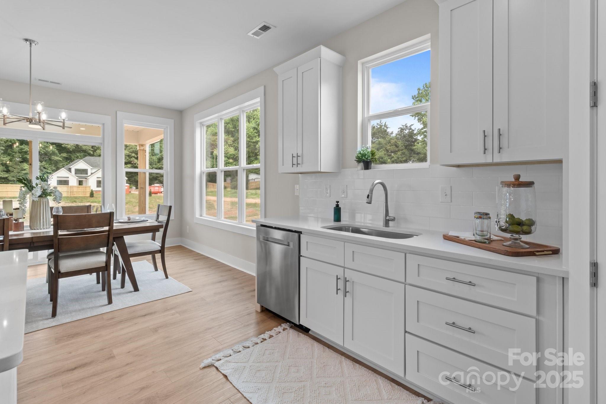 4949 Rimer Road, Unit 4 Concord, NC 28025 - Photo 14 of 46 a kitchen with a sink and cabinets
