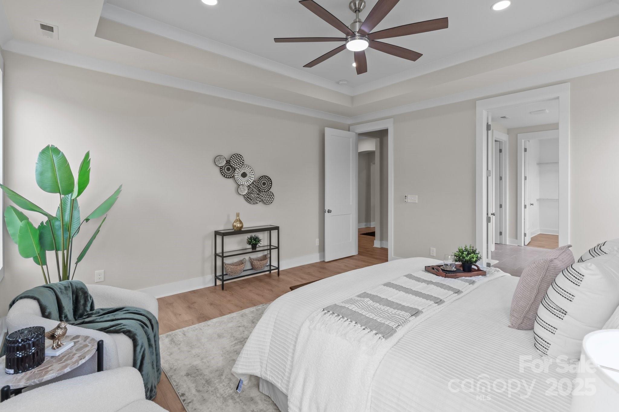4949 Rimer Road, Unit 4 Concord, NC 28025 - Photo 16 of 46 a bedroom with a bed couch and a potted plant