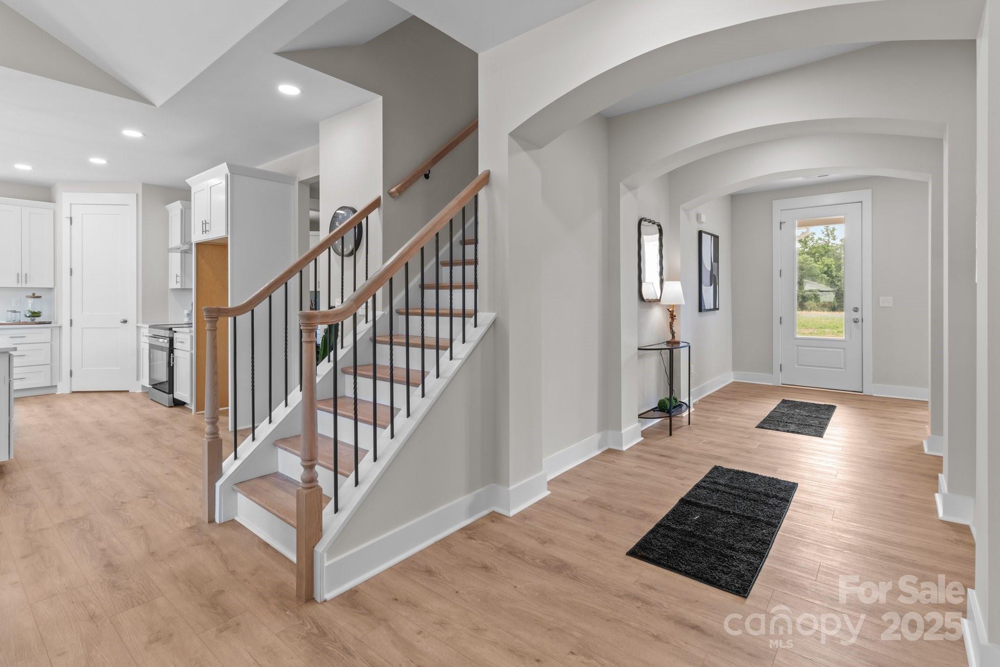 4949 Rimer Road, Unit 4 Concord, NC 28025 - Photo 17 of 46 a view of a hallway with wooden floor and a living room
