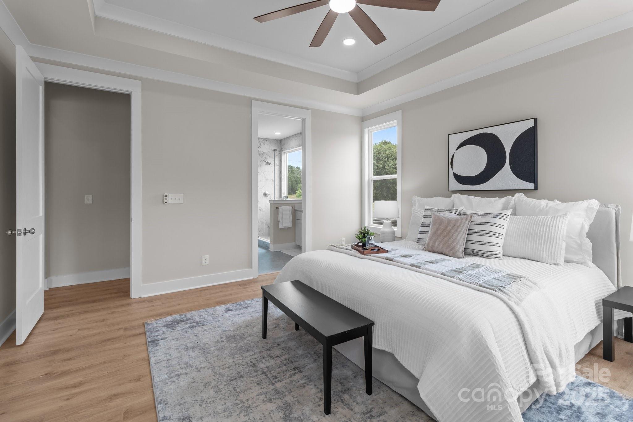 4949 Rimer Road, Unit 4 Concord, NC 28025 - Photo 20 of 46 a bedroom with a bed and a chandelier
