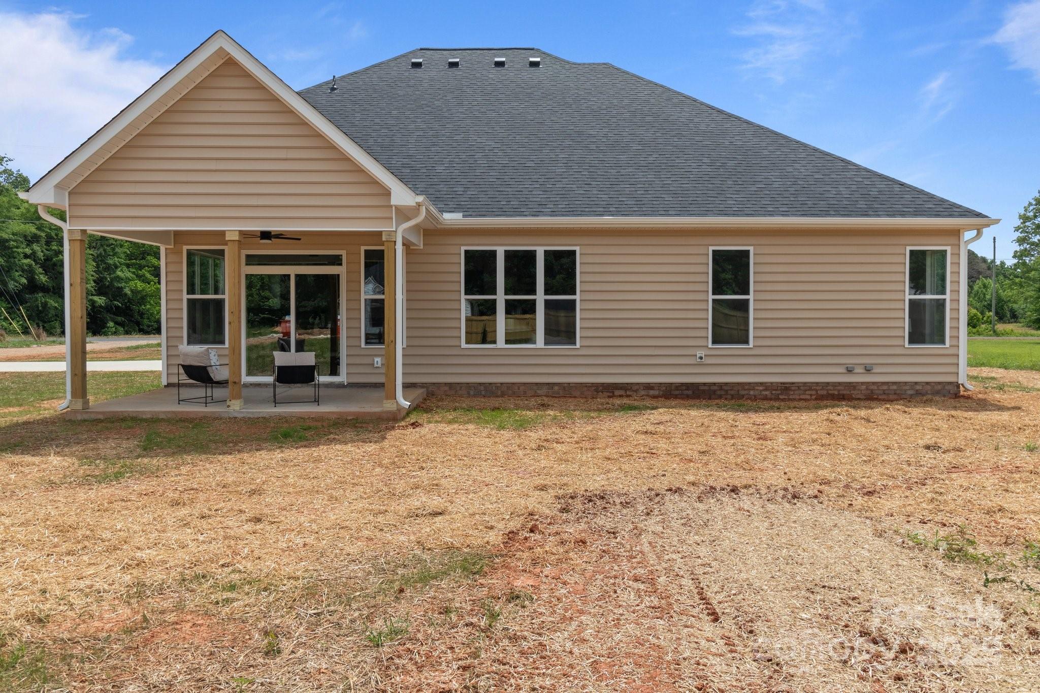 4949 Rimer Road, Unit 4 Concord, NC 28025 - Photo 21 of 46 front view of a house with a yard