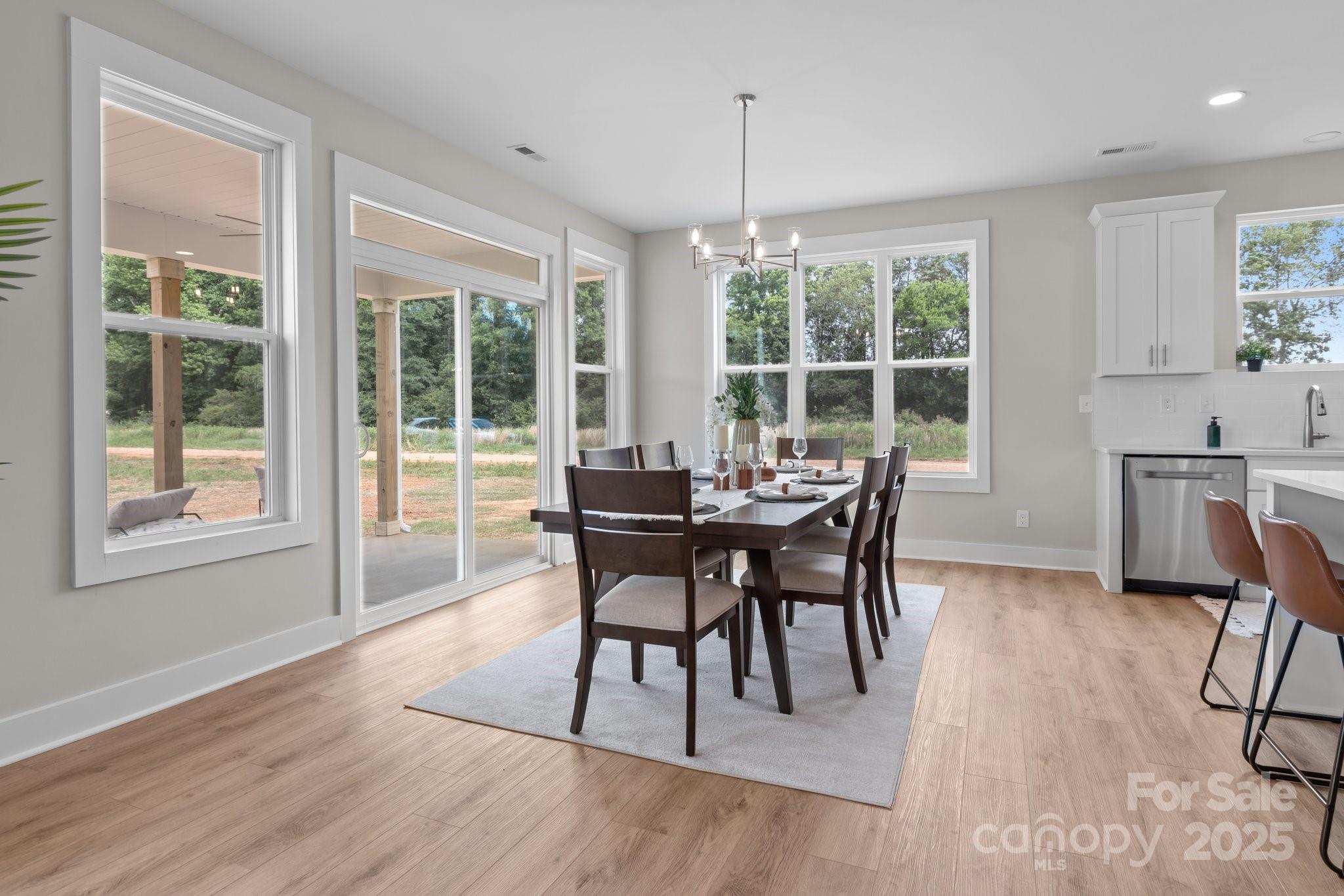 4949 Rimer Road, Unit 4 Concord, NC 28025 - Photo 25 of 46 a dining room with furniture window wooden floor