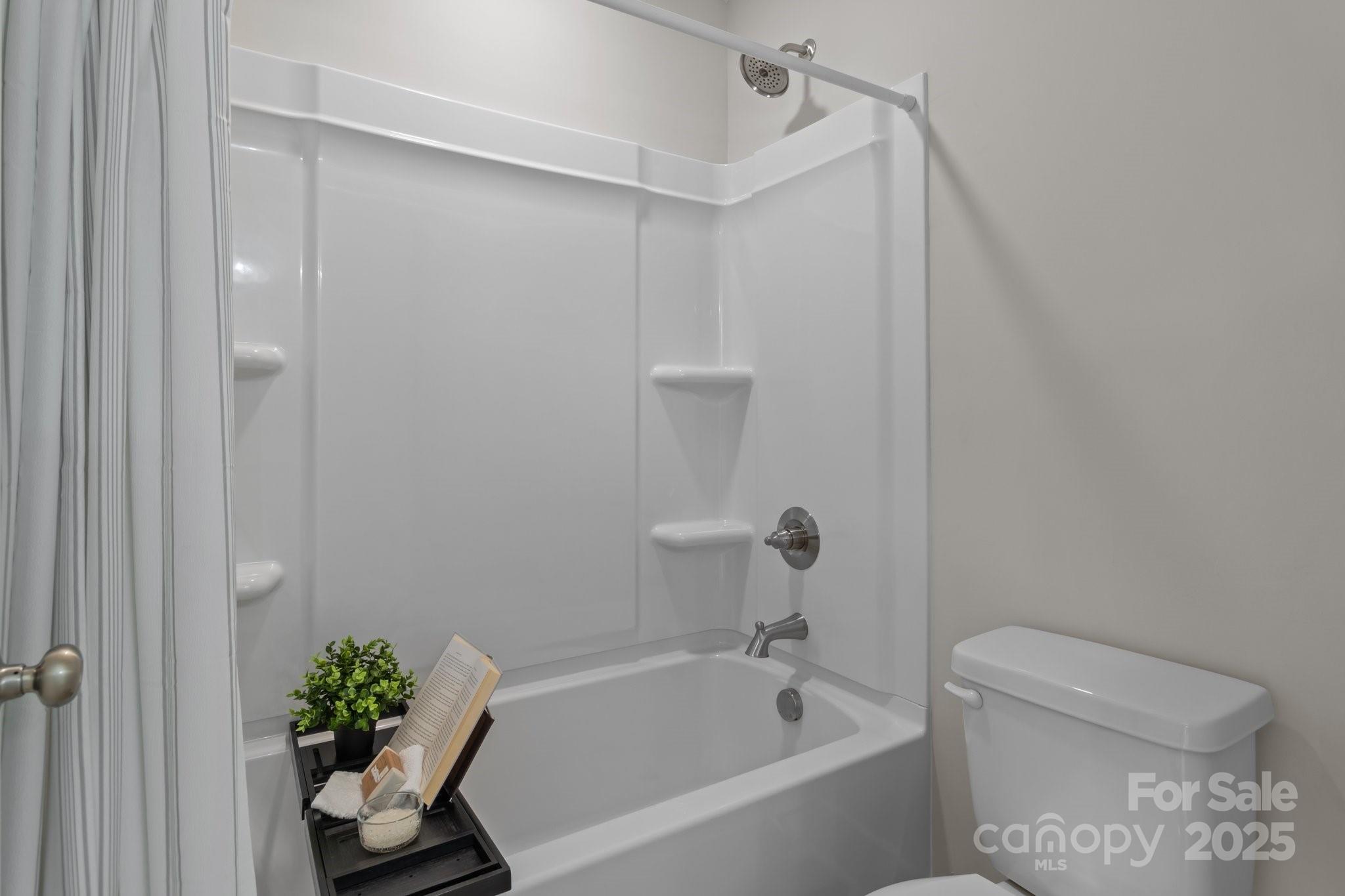 4949 Rimer Road, Unit 4 Concord, NC 28025 - Photo 26 of 46 a white bath tub sitting next to a toilet