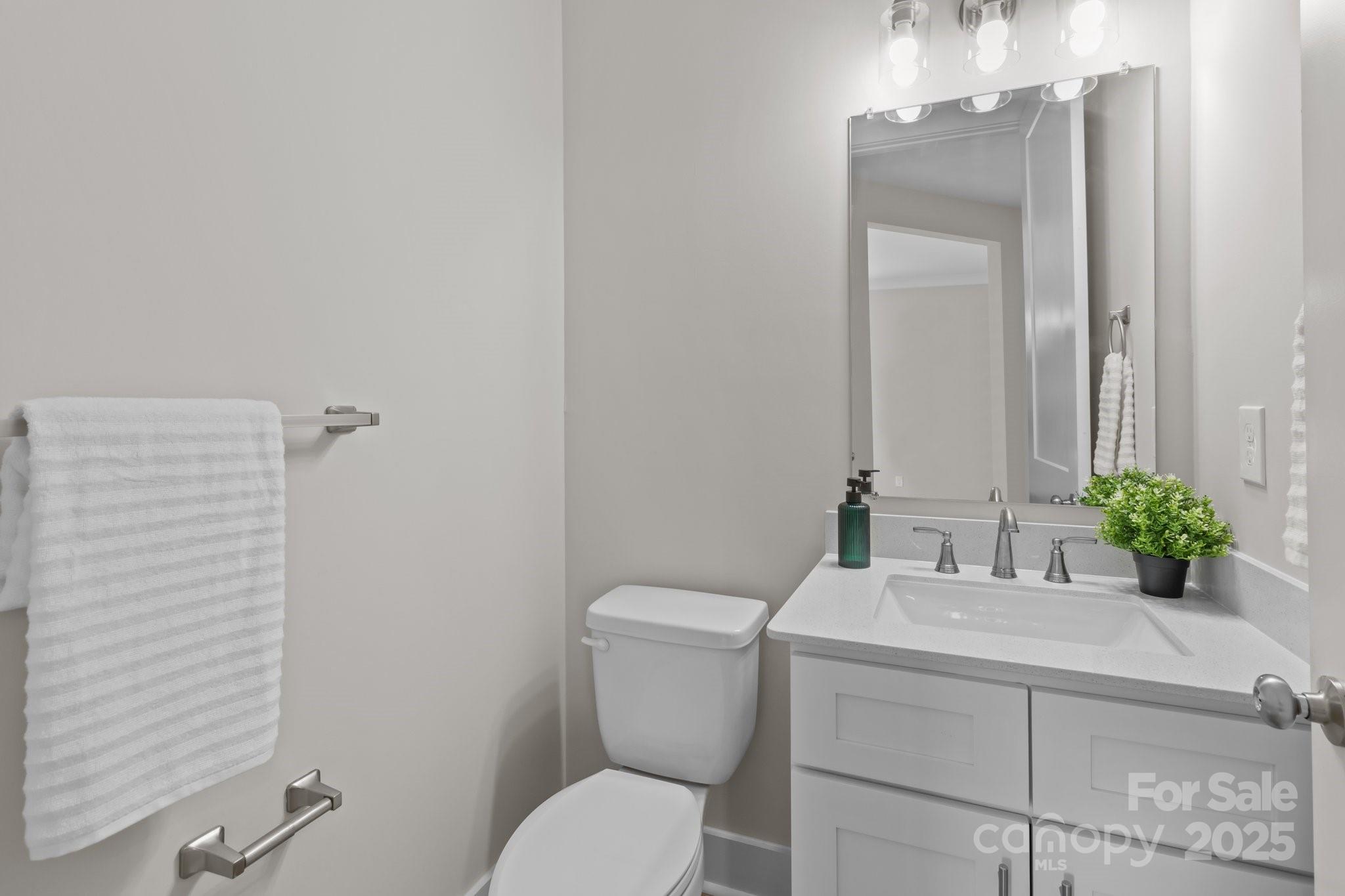 4949 Rimer Road, Unit 4 Concord, NC 28025 - Photo 37 of 46 a bathroom with a toilet sink and mirror