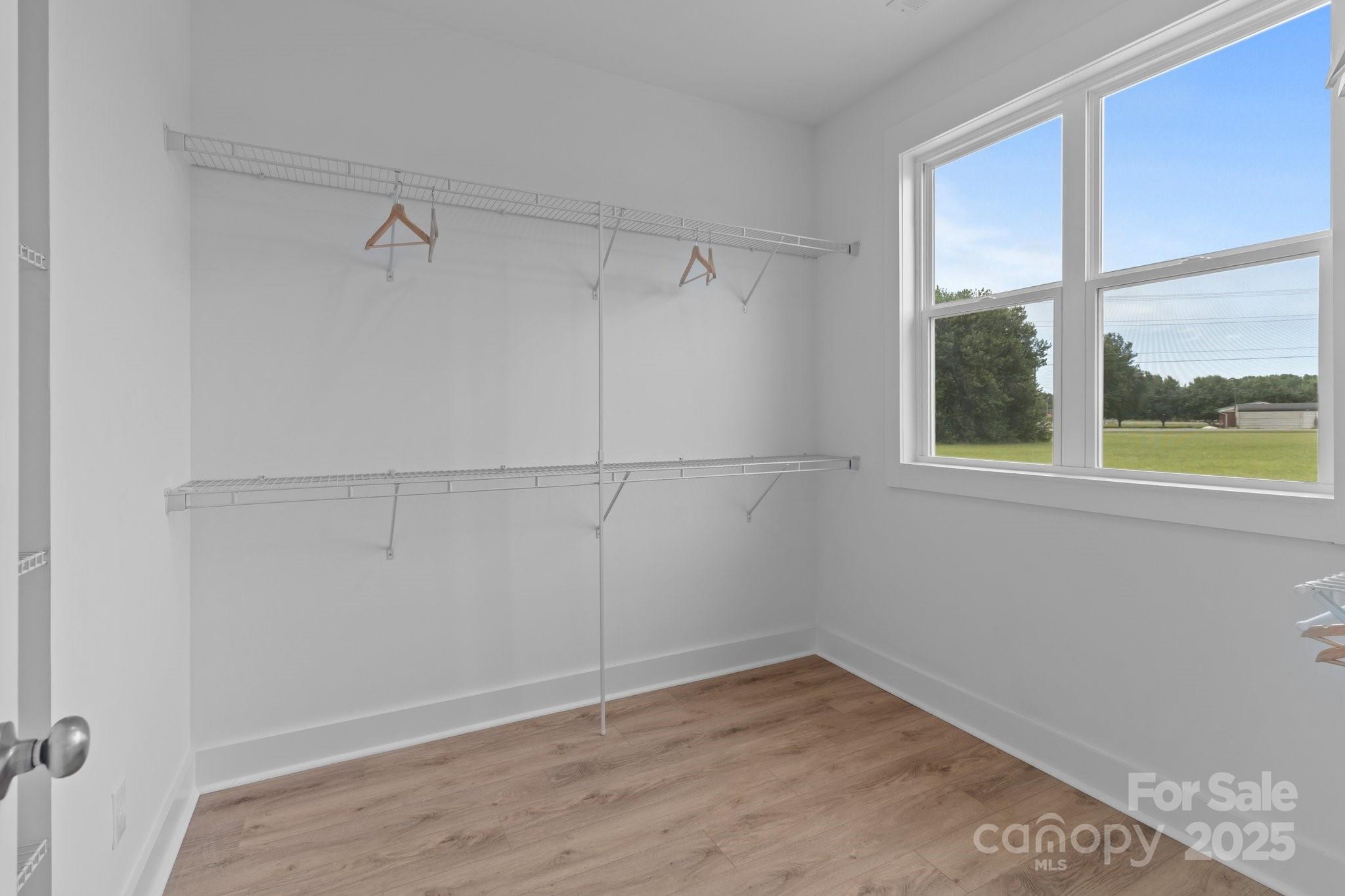 4949 Rimer Road, Unit 4 Concord, NC 28025 - Photo 38 of 46 a view of a small space with wooden floor and windows