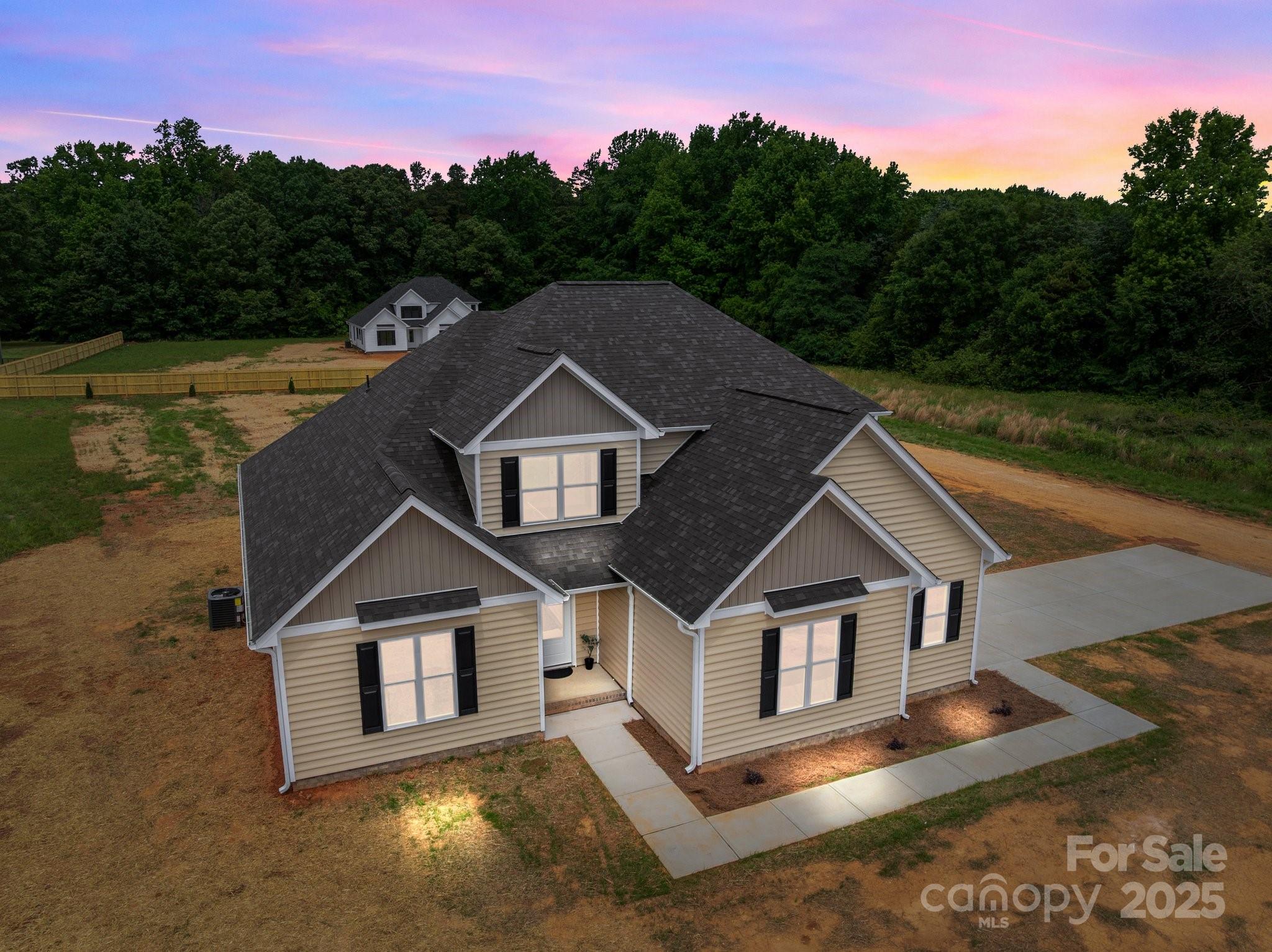 4949 Rimer Road, Unit 4 Concord, NC 28025 - Photo 39 of 46 a front view of a house with a yard