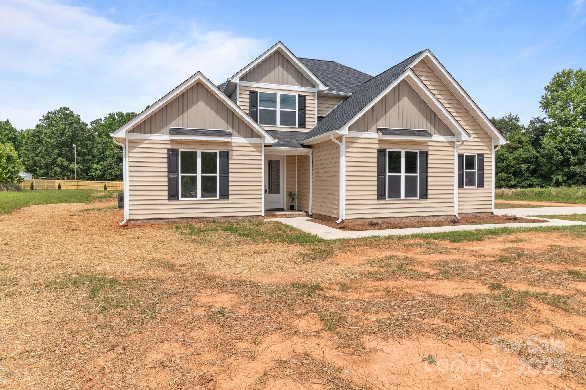 4949 Rimer Road, Unit 4 Concord, NC 28025 - Photo 40 of 46 a front view of a house with a yard