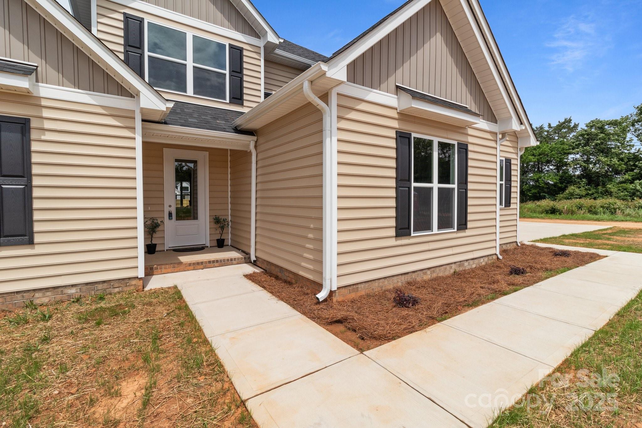 4949 Rimer Road, Unit 4 Concord, NC 28025 - Photo 41 of 46 a view of a house with a yard