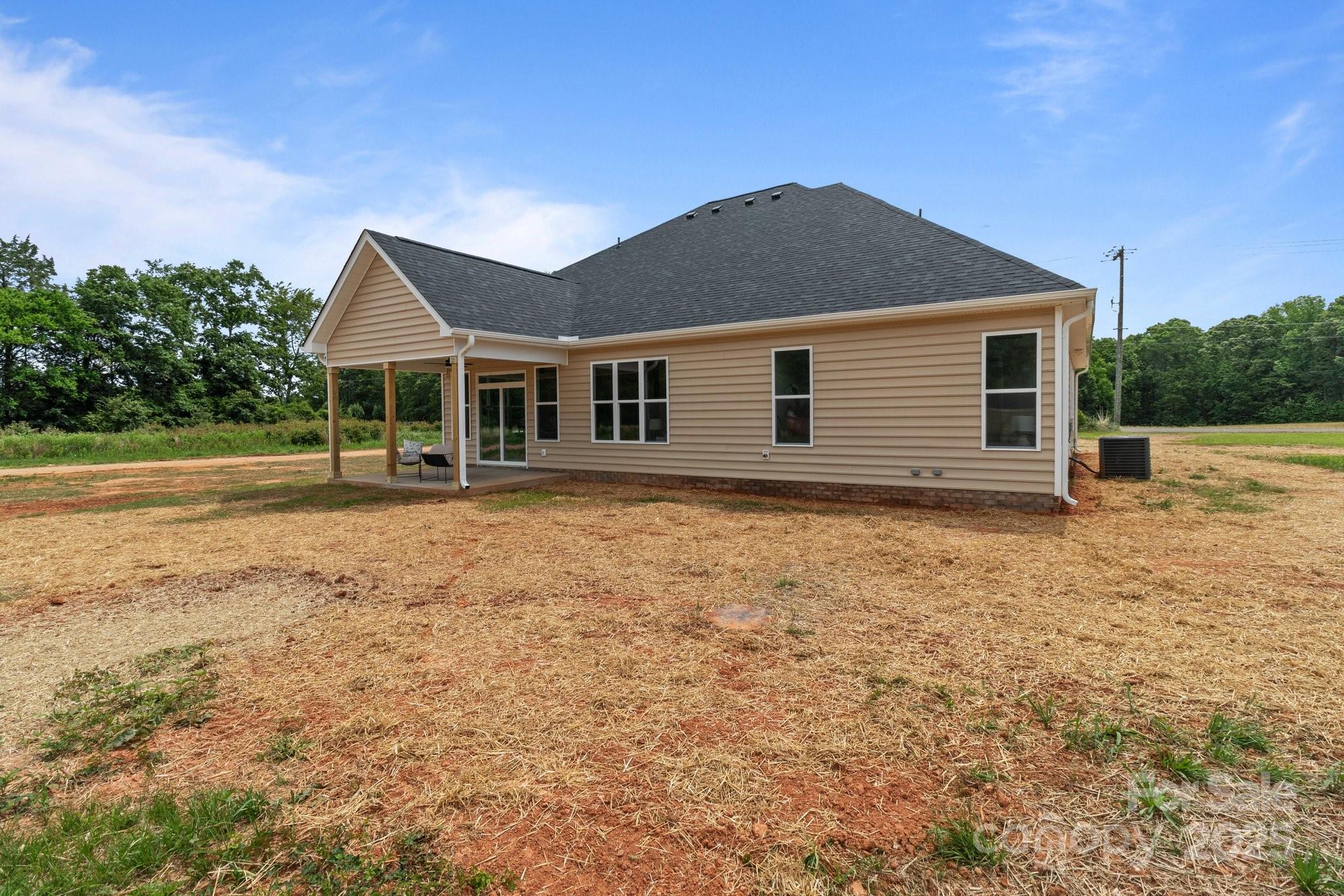 4949 Rimer Road, Unit 4 Concord, NC 28025 - Photo 43 of 46 a front view of a house with a yard