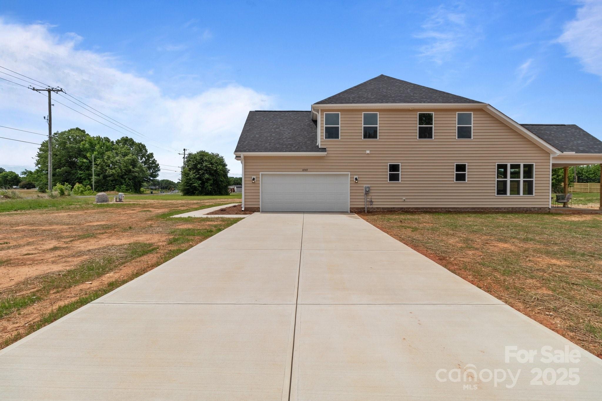 4949 Rimer Road, Unit 4 Concord, NC 28025 - Photo 44 of 46 a front view of a house with a yard