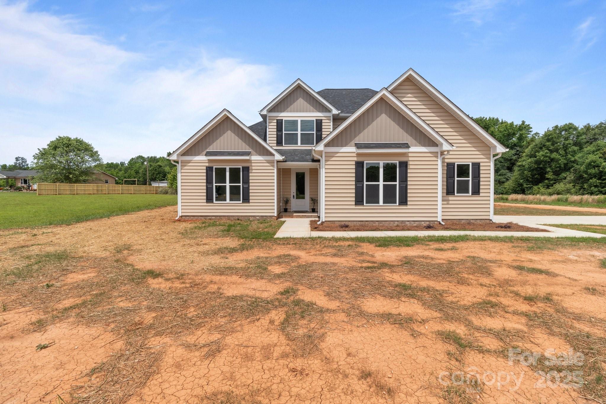 4949 Rimer Road, Unit 4 Concord, NC 28025 - Photo 46 of 46 a front view of a house with yard
