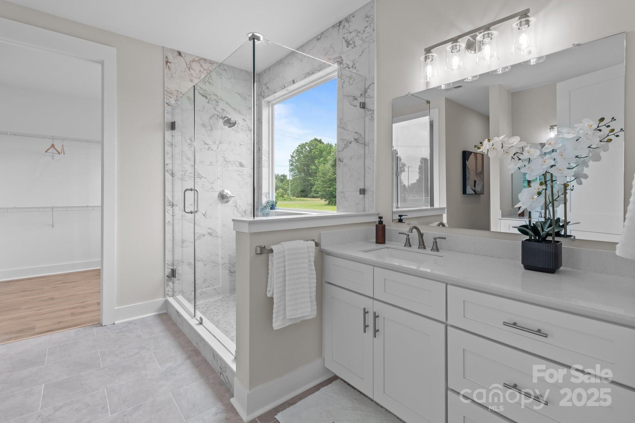 4949 Rimer Road, Unit 4 Concord, NC 28025 - Photo 6 of 46 a bathroom with a double vanity sink mirror and shower