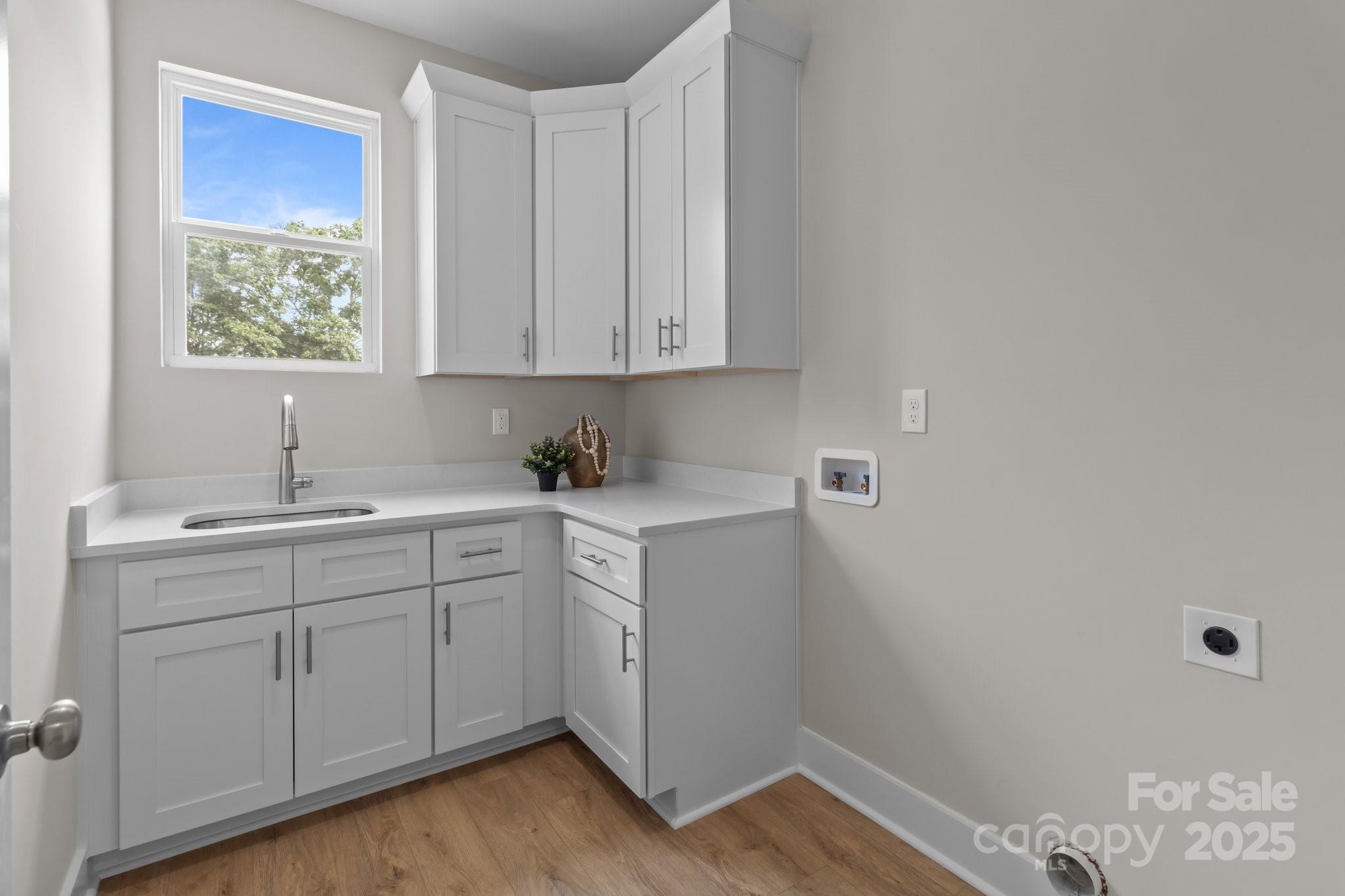 4949 Rimer Road, Unit 4 Concord, NC 28025 - Photo 10 of 46 a room with a sink cabinets and utility room