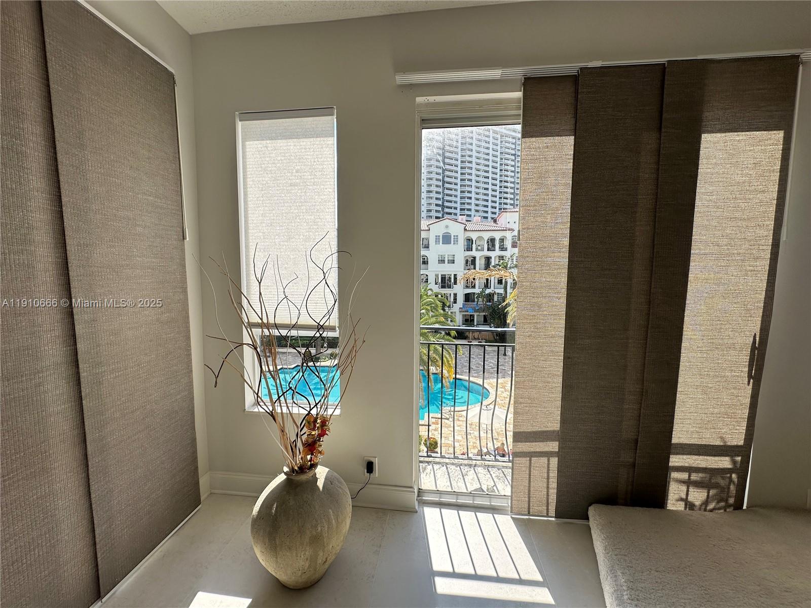 3900 Island Boulevard, Unit B303 Aventura, FL 33160 - Photo 22 of 35 a view of entryway with wooden floor and door