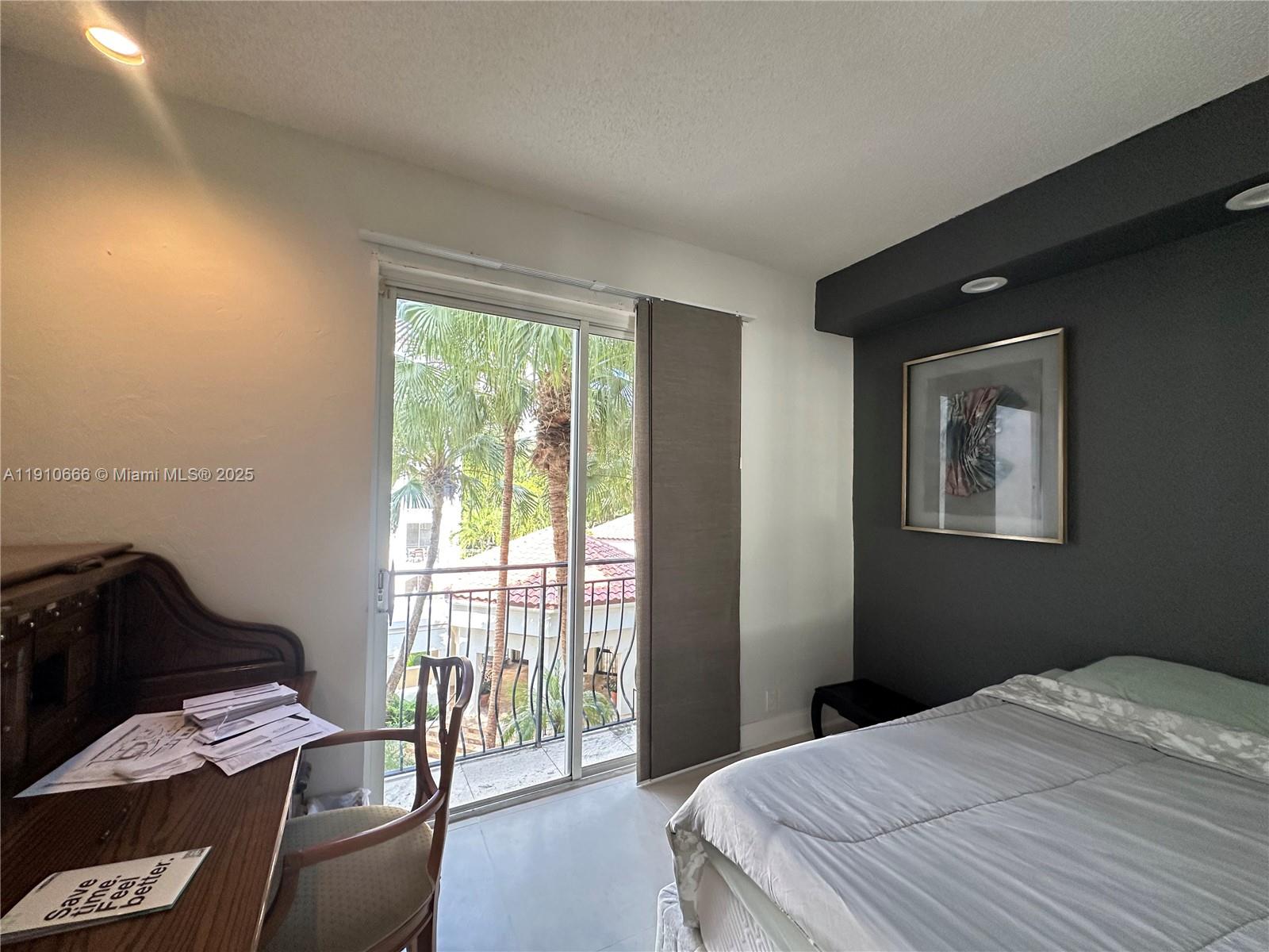 3900 Island Boulevard, Unit B303 Aventura, FL 33160 - Photo 34 of 35 a bedroom with a bed and wooden floor