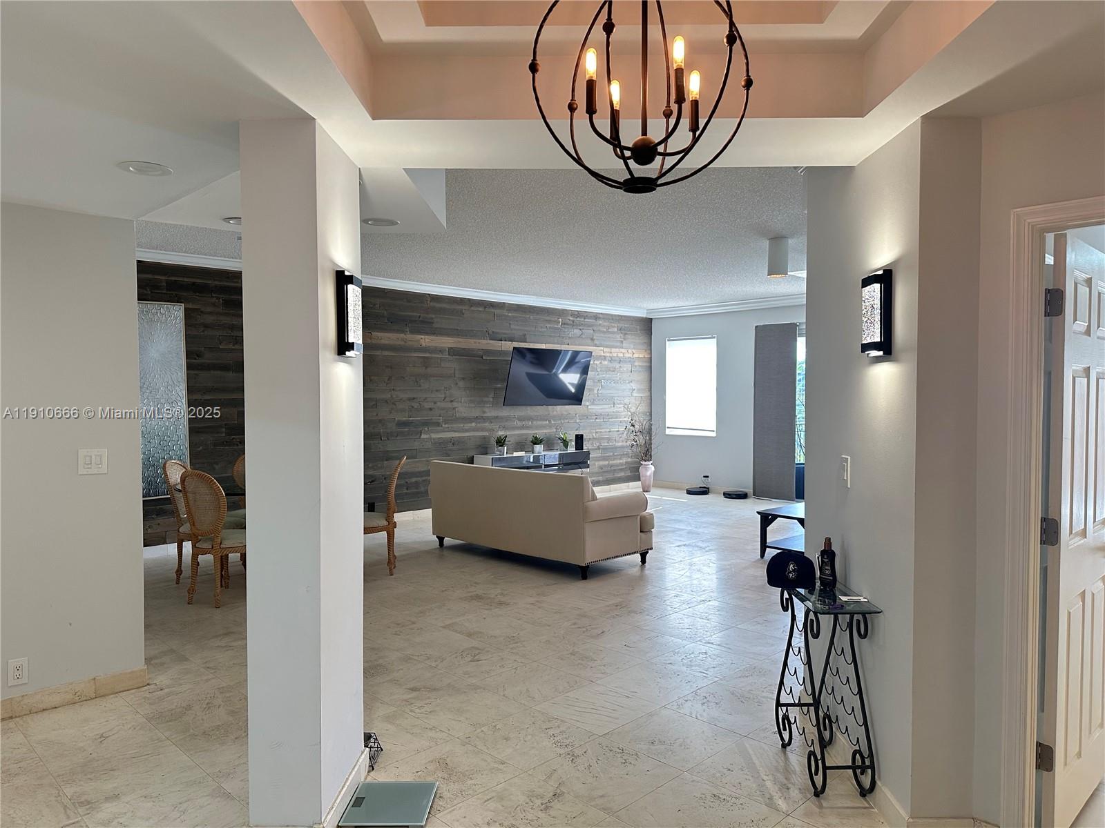 3900 Island Boulevard, Unit B303 Aventura, FL 33160 - Photo 4 of 35 a view of hall way with furniture