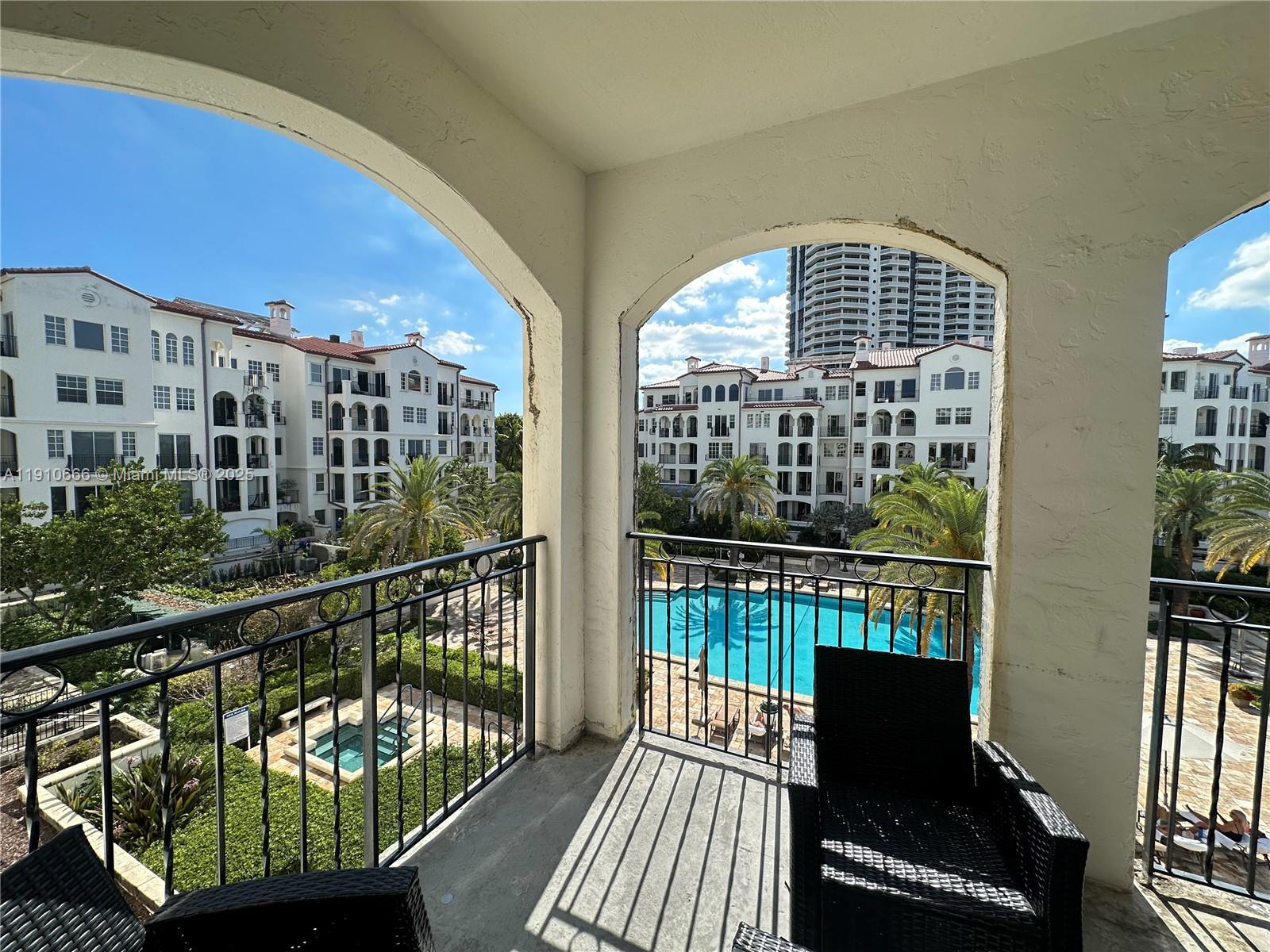 3900 Island Boulevard, Unit B303 Aventura, FL 33160 - Photo 8 of 35 a view of a balcony with wooden floor