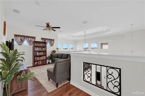 a view of staircase with wooden floor and a potted plant