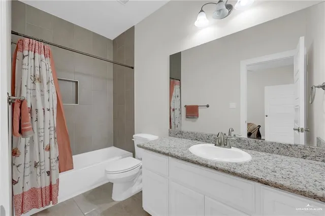 a view of a hallway with wooden floor and windows