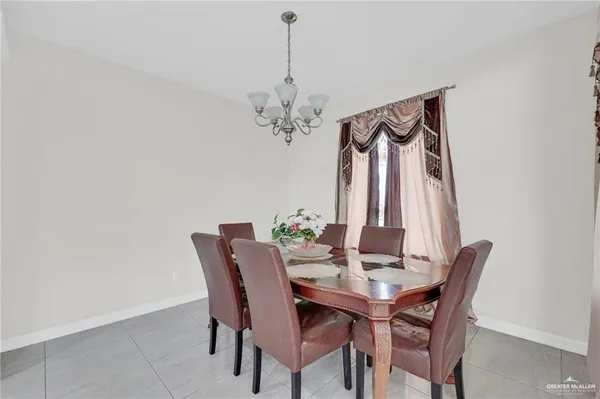 a large white kitchen with a large window