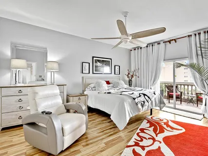 a bed room with bed and a large window