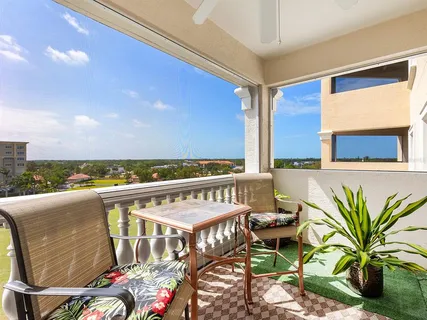 a view of a balcony with chairs