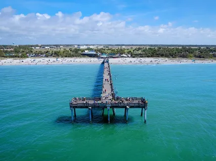 a view of a lake with a table and chairs
