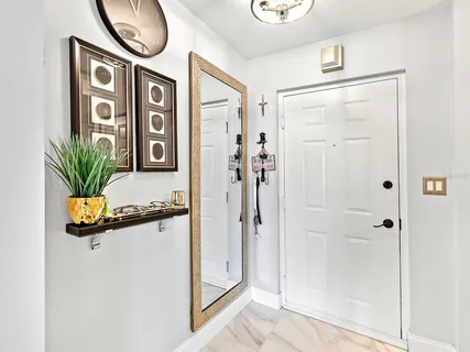 a picture of a bathroom with a shower and a sink