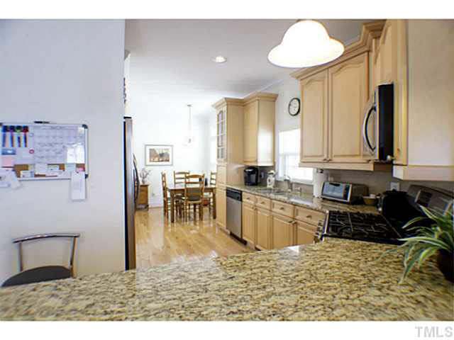 1172 Harp Street Raleigh, NC 27604 - Photo 11 of 25 Another viiew of the kitchen from family room showing the breakast room Kitchen