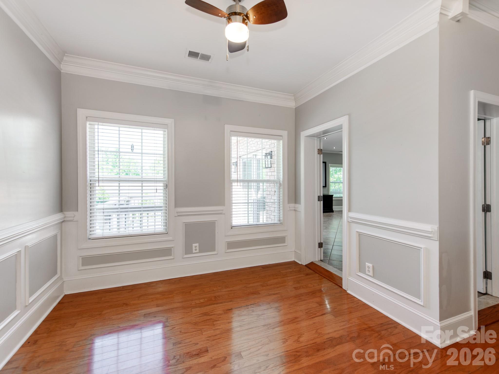 783 Sloan Street Denver, NC 28037 - Photo 20 of 44 a view of an empty room with a window and wooden floor