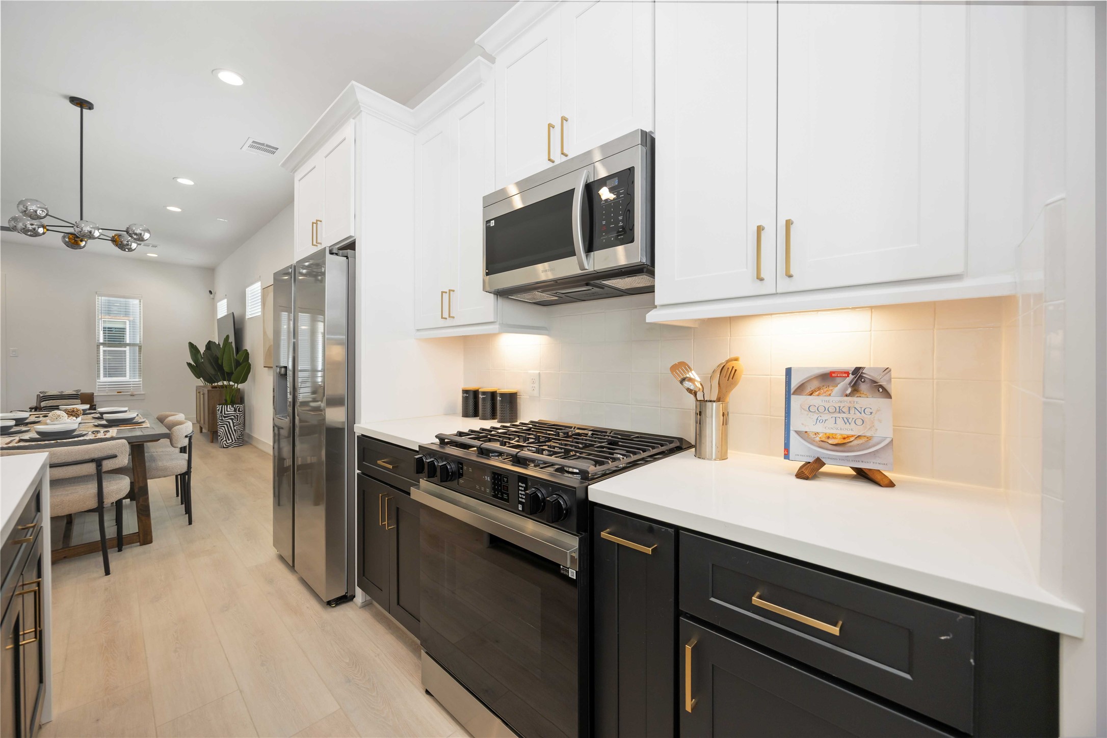 7805 Amelia Road, Unit B Houston, TX 77055 - Photo 16 of 35 Island kitchen. Photo of the model home. Finishes & specifications may vary.