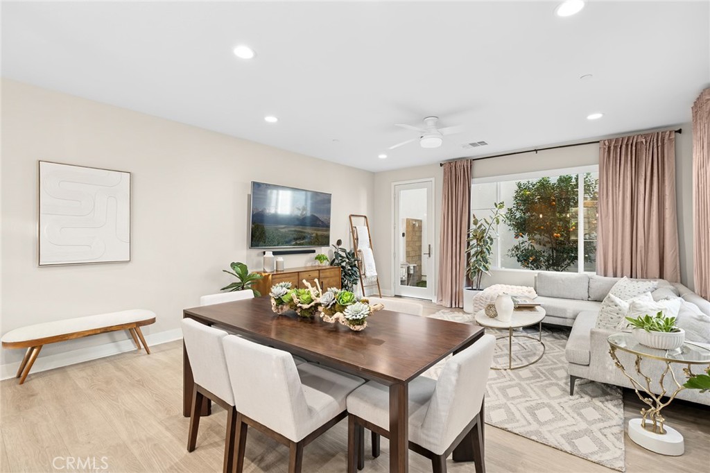 163 Tenor Irvine, CA 92618 - Photo 15 of 40 a living room with furniture and a flat screen tv