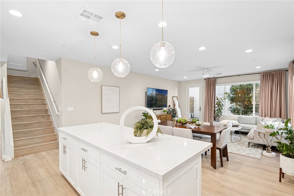 163 Tenor Irvine, CA 92618 - Photo 16 of 40 a living room with furniture potted plant and a large window