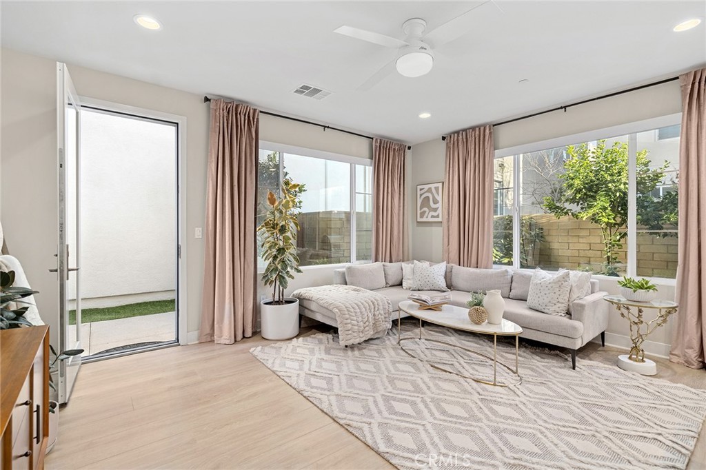 163 Tenor Irvine, CA 92618 - Photo 18 of 40 a living room with furniture and large windows