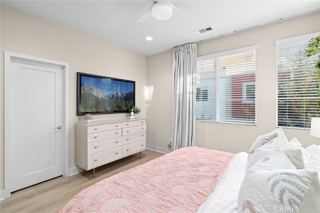 163 Tenor Irvine, CA 92618 - Photo 26 of 40 a bedroom with a bed and a flat screen tv