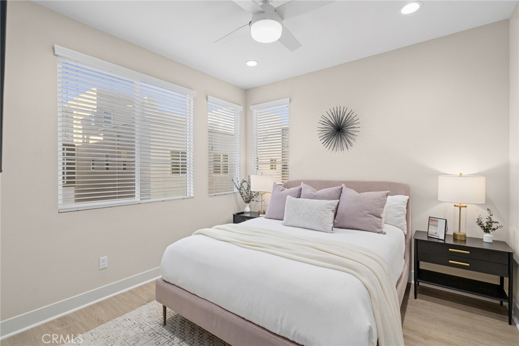 163 Tenor Irvine, CA 92618 - Photo 28 of 40 a bedroom with a bed and a chandelier