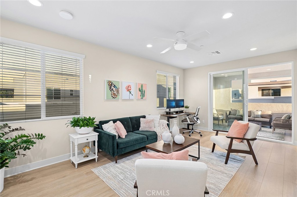 163 Tenor Irvine, CA 92618 - Photo 6 of 40 a living room with furniture and a potted plant